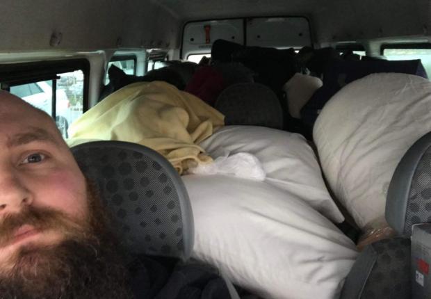 Bridport and Lyme Regis News: The 31-year-old from Lyme Regis, Dorset, has filled his 14ft minivan with donated sleeping bags, children's toys, coats, and tinned food left outside his pub. Picture: BNPS