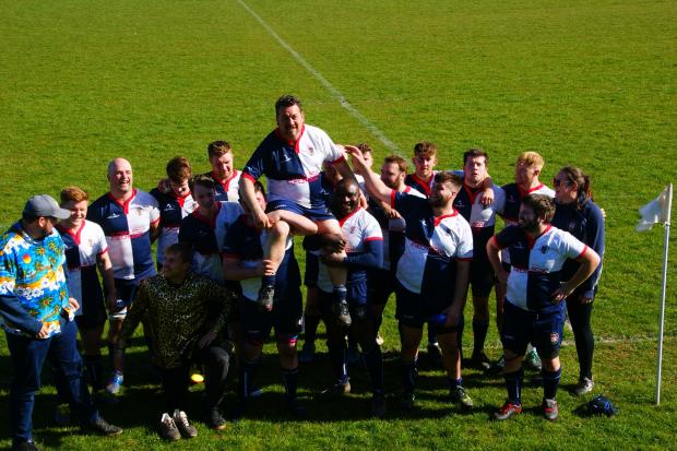 Bridport and Lyme Regis News: Brett Chant is chaired off the field after his final Bridport game in April Picture: STUART BRIGGS