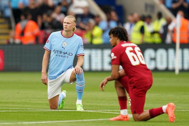 Manchester City's Erling Haaland and Liverpool's Trent Alexander-Arnold taking a knee before the FA Community Shield (PA)