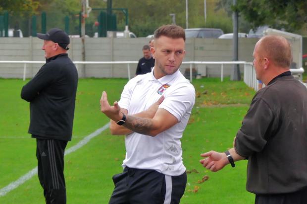 Bridport boss Chris Herbst, centre, has reflected on his first season managing the Bees