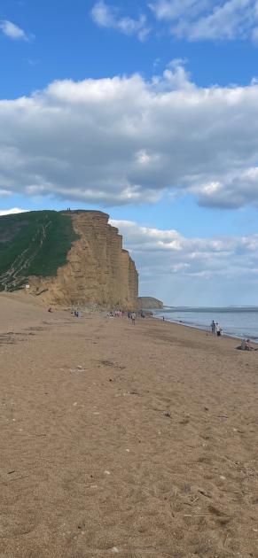 West Bay: Beachgoers below Dorset cliffs before rockfall
