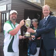 Paul Pomeroy was crowned men's singles champion by Simon Wakely, right		          Pictures: LRBC