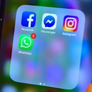 Stock photo of Facebook, Messenger, Instagram and WhatsApp social media app icons on a smart phone
