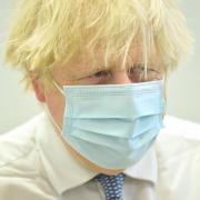 Prime Minister Boris Johnson during a visit to the Stow Health Vaccination centre in Westminster, central London. Picture date: Monday December 13, 2021. Credit: PA