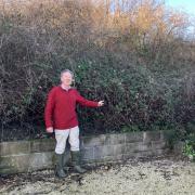 Neil Mattingly next to six foot bank which would have to be lowered if a footpath were to be routed