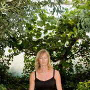 A woman meditating in a garden Picture: Alamy/PA