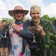 Lindy Rogers and Non-stop Niall celebrate with their mens and women trophies at the World nettle eating championships at the Dorset Nectar Cider Farm at Waytown - 25th June 2022.  Picture Credit: Graham Hunt Photography