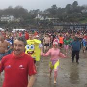 Swimmers racing to the sea at last years Lyme Regis Lunge