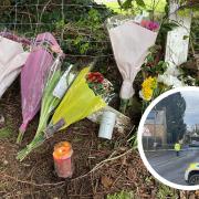 Flowers left on the A3066 in Mosterton after a fatal crash in the village on Wednesday which killed a woman in her 40s.