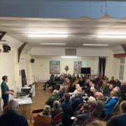 Sam Wilberforce discussing the economics of solar panels at a meeting in Bridport