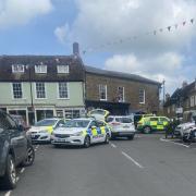 Emergency services at The Square in Beaminster. A car crash took place in nearby Fleet Street