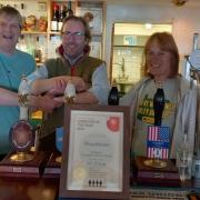 Left to Right. West Dorset CAMRA chairman Bruce Mead, Woodman Licensee Darren Moore & West Dorset CAMRA Cider Rep Alex Bardswell presenting the West Dorset Cider Pub of the Year Award