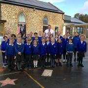 Headteacher Leif Overment with pupils of Salway Ash Primary School