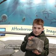 Myles, the 100,000th visitor to the Charmouth Heritage Coast Centre