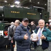 Douglas Beazer presenting Pete Waterman with the Dorset apple cake at the NEC on Saturday