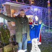 Martin Clunes switches on the Christmas lights at Bradpole home