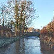 Flood and ice risk on Village Road between Bradpole and Loders