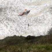 Three rescued by helicopter after being cut off by tide