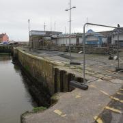 Repairs to West Bay's harbour have now begun forcing food outlets nearby to close