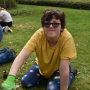 Students planting bulbs at Weldmar Hospicecare's Inpatient Unit gardens
