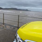 Lyme Regis coastgurad and lifeboat teams were called to help a swimmer in the sea who had been cut off by the tide
