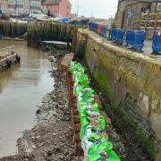 Emergency repairs to West Bay's harbour wall have been completed ahead of schedule