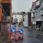 Scaffolding and temporary traffic lights are in place on Bridge Street in Lyme Regis
