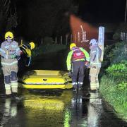 Crews mobilised to vehicle stuck in flood water on Gassons Lane, Whitchurch Canonicorum Village in Bridport