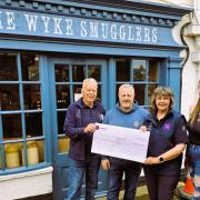Two Trustees of Freedom, Peter York and Chris Marlow visited The Wyke Smugglers pub to receive a cheque for £500 from Landlord Keith Treggiden and Becki Hunter.
