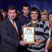 MONEY MATTERS: Members of the West Dorset Youth Back pick up their award from Oliver Letwin MP