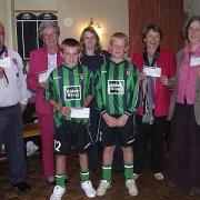 GOOD CAUSES: Some of the representatives collect their cheques