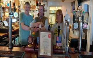 Left to Right. West Dorset CAMRA chairman Bruce Mead, Woodman Licensee Darren Moore & West Dorset CAMRA Cider Rep Alex Bardswell presenting the West Dorset Cider Pub of the Year Award