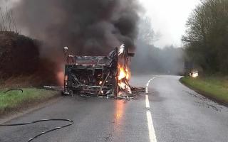 A bus on fire has caused the A35 to close near Axminster