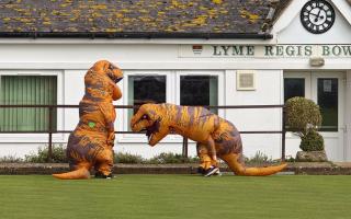 Two T-Rex figures were seen enjoying the facilities at Lyme Regis Bowling Club ahead of the new season
