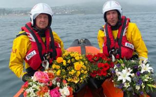 Last year's blessing of the boats showing lifeboat crew members Andy Butterfield and Elliott Herbert with wreaths