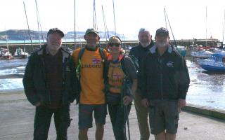 Antony and Sally Brown with Lyme Regis RNLI crew members John Cable, Nick Marks and John Bird