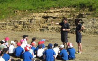 The Jurassic Coast Trust's Sam Scriven with a school group near the site in 2014 Picture: Jurassic coast Trust
